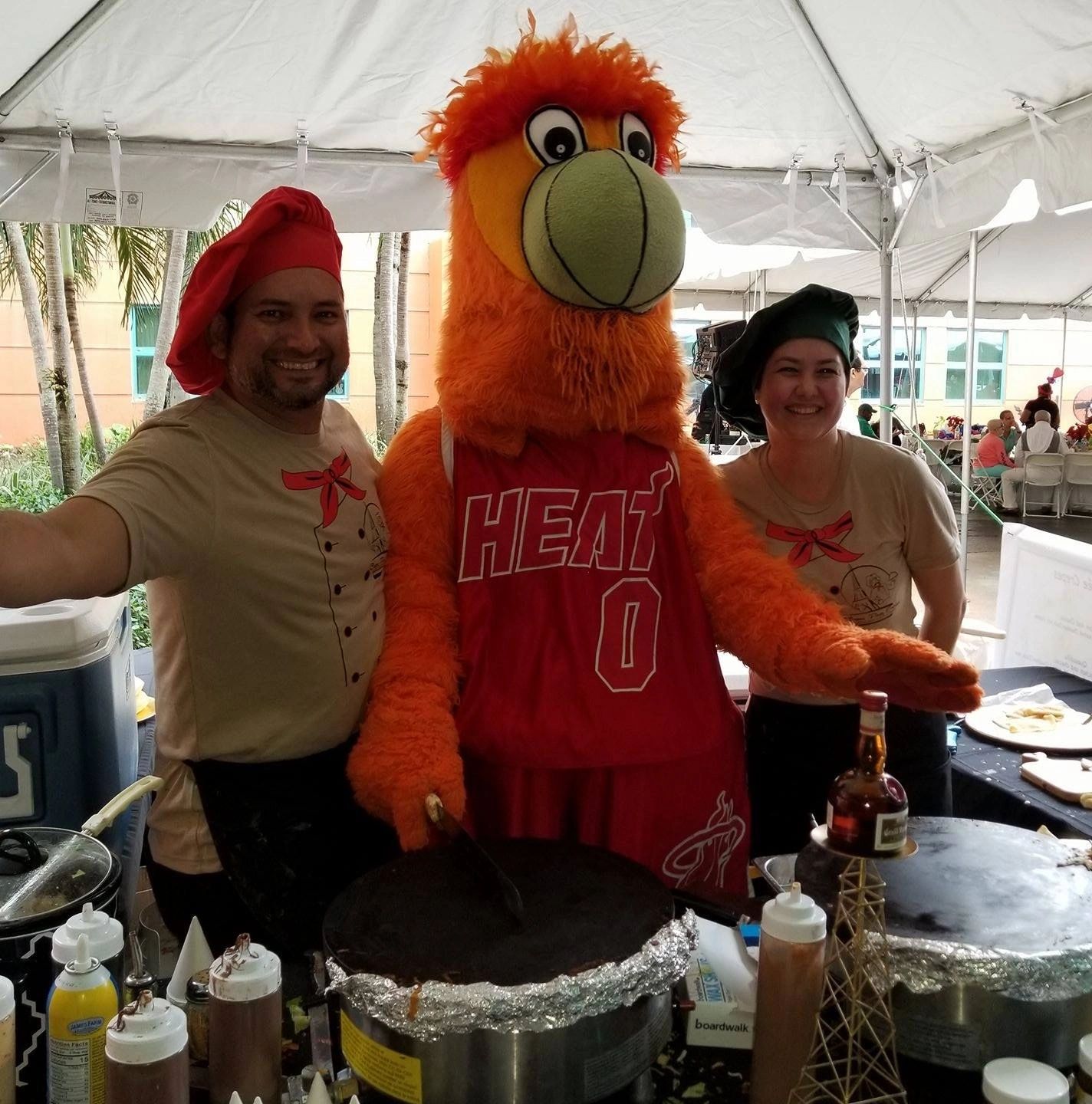 Crepes Party Express chefs with Burnie, the Miami Heat mascot, at a live crepe station